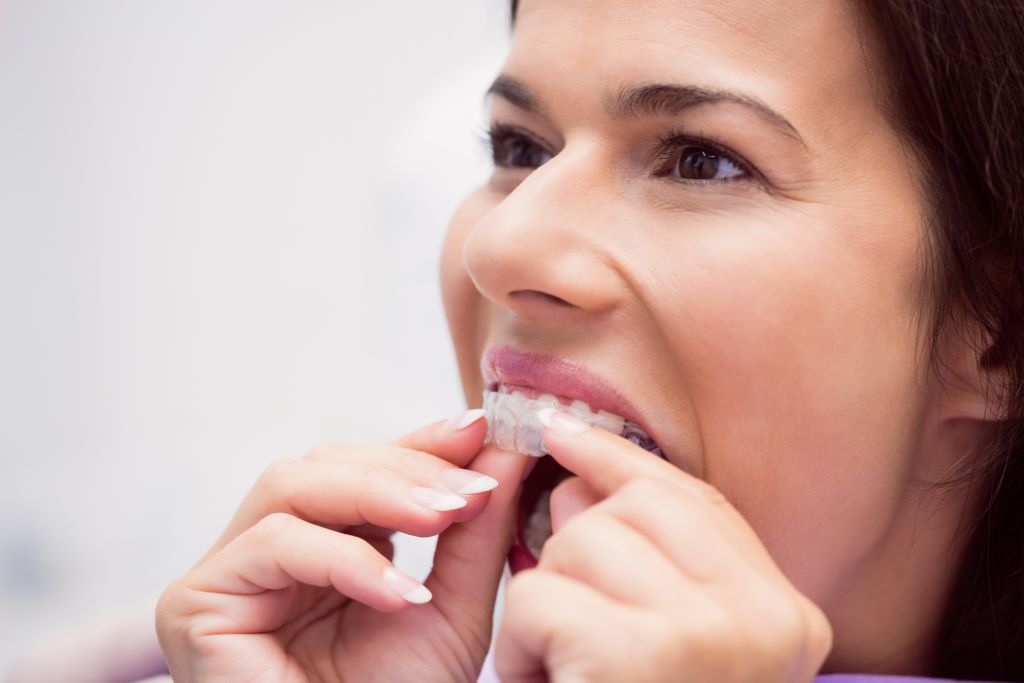 Good Candidate for Invisalign Treatment Patient wearing traditional braces at Progressive Dentistry & Orthodontics — image pending replacement with a clear aligner tray photo