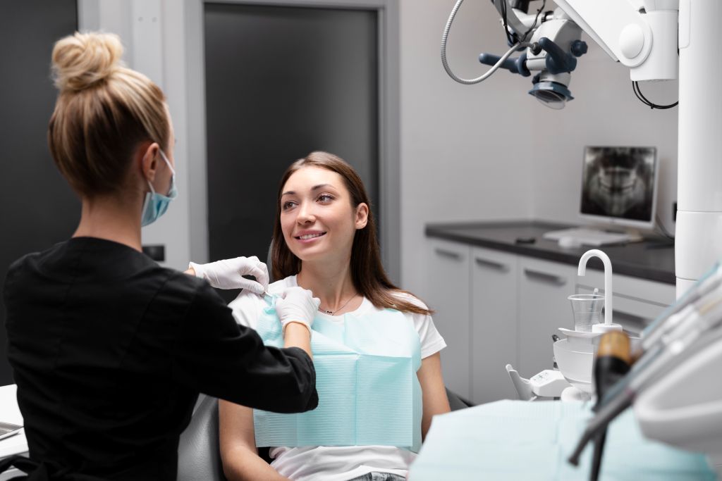 Dental Implant For Smokers Dentist and patient having a judgment-free consultation about dental implants for smokers at Progressive Dentistry & Orthodontics in Chandler, AZ